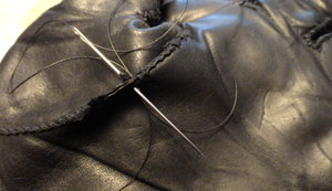 old glove being repaired